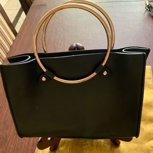 Mini trendy leather or vinyl bag with gold color round handles